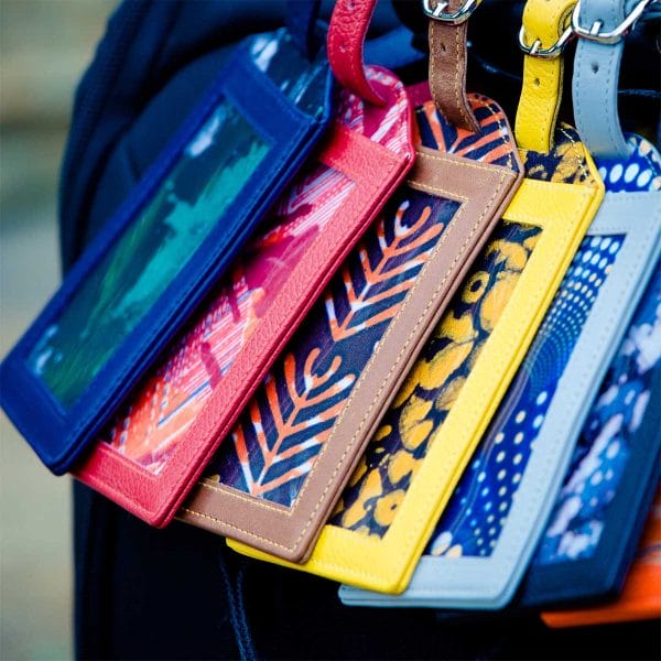 Row of multicolored luggage tags close up