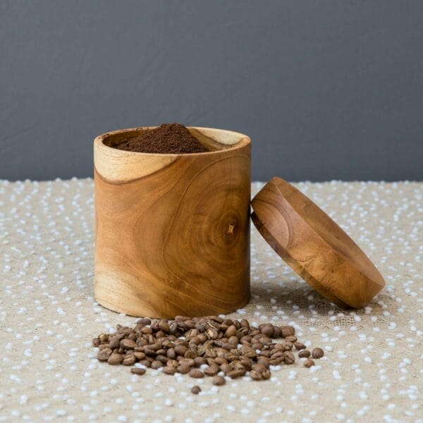 coffee canister with beans beside