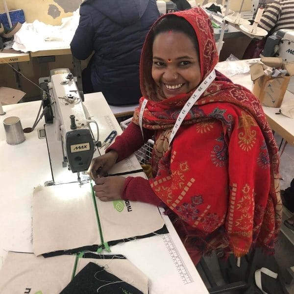 woman in headscarf at sewing mach