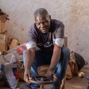A craftsman from Atelier Calla works at a wheel to create unique gifts from Haiti