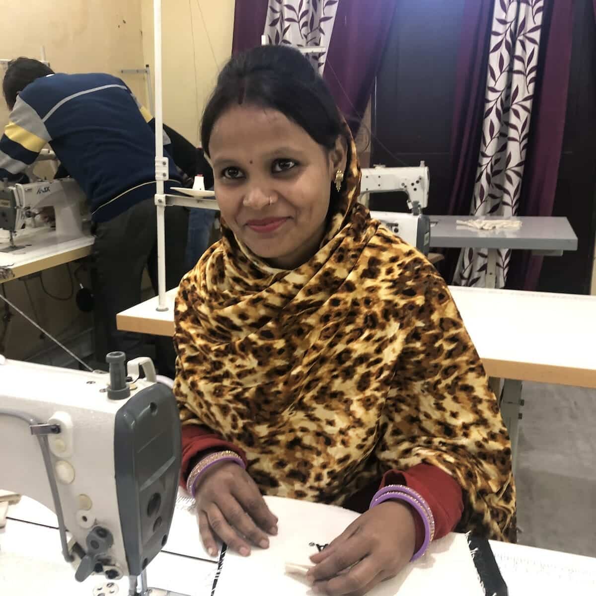 Our screen printed aprons are created by the workers at Work+Shelter, like the woman pictured here in the workshop.