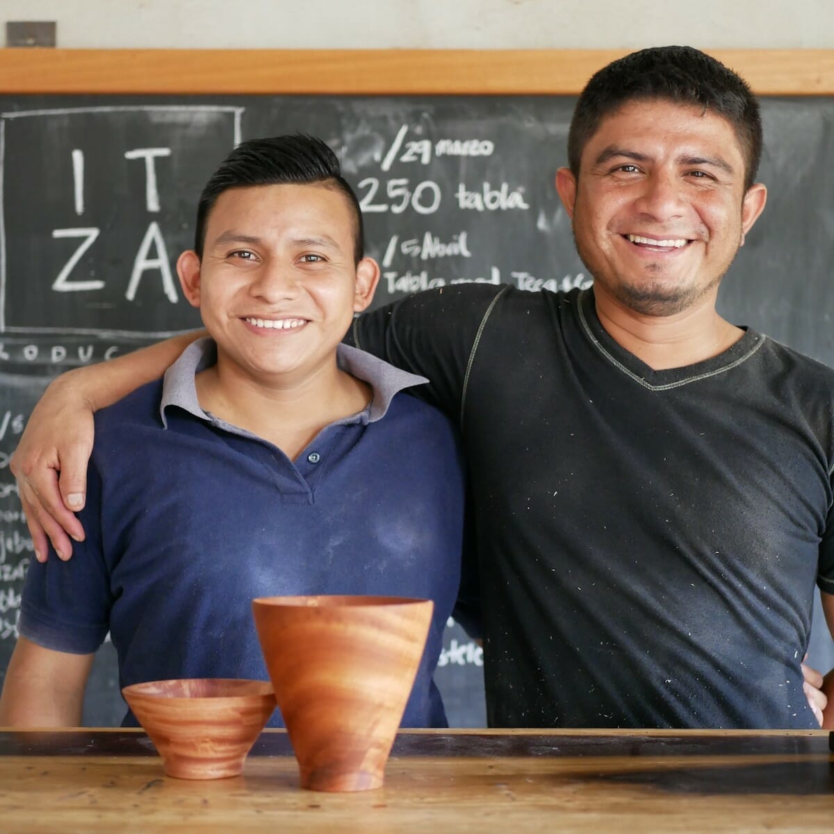 The board in our charcuterie board gift set is created by Itza Wood, including the two men smiling here.