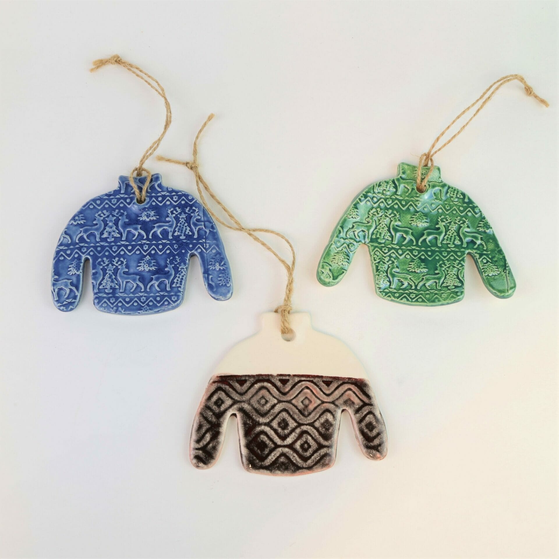 Three ugly sweater custom ornaments in various colors Three ugly sweater custom ornaments in various colors