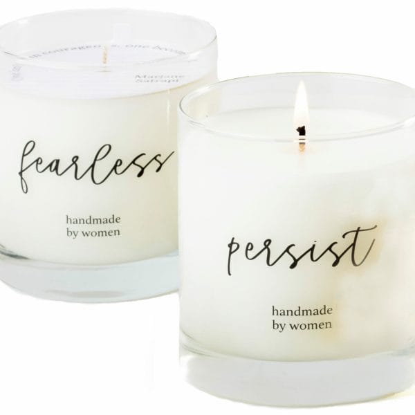 The pampering gift basket includes a glass candle with different available messages, such as "fearless" and "persist."