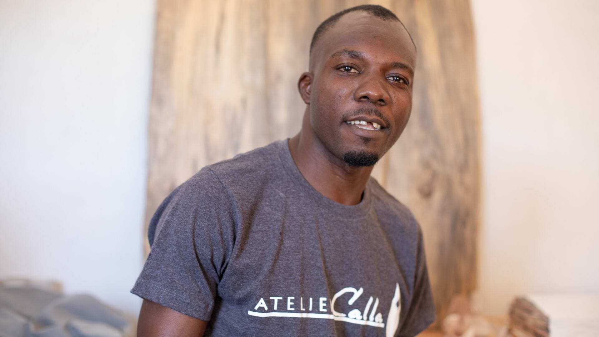 A portrait of Jonas in an Atelier Calla t-shirt